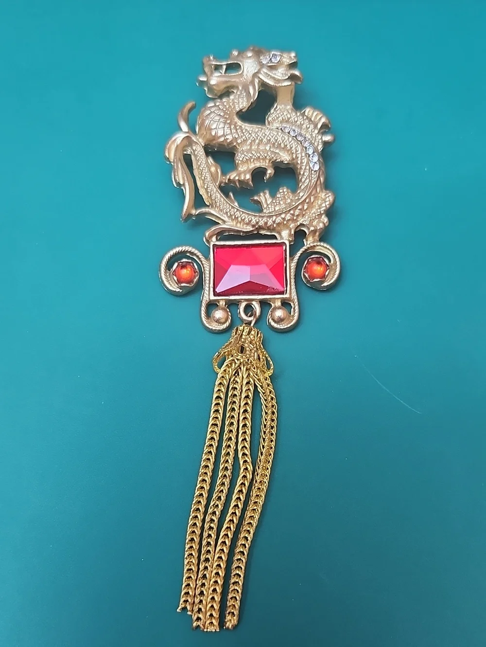 Gold Dragon Tassel Brooch with Red Gemstones